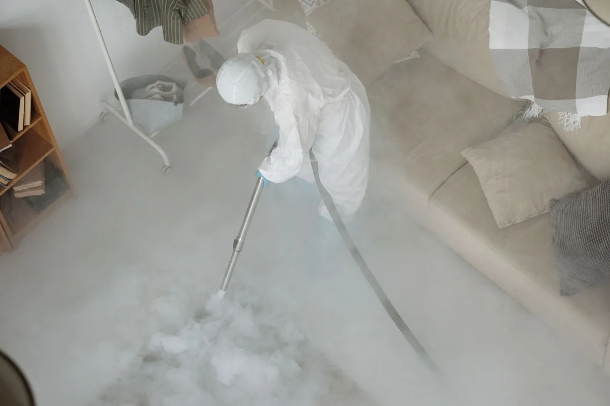 Biohazard cleanup technician in protective equipment, Dayton, MN